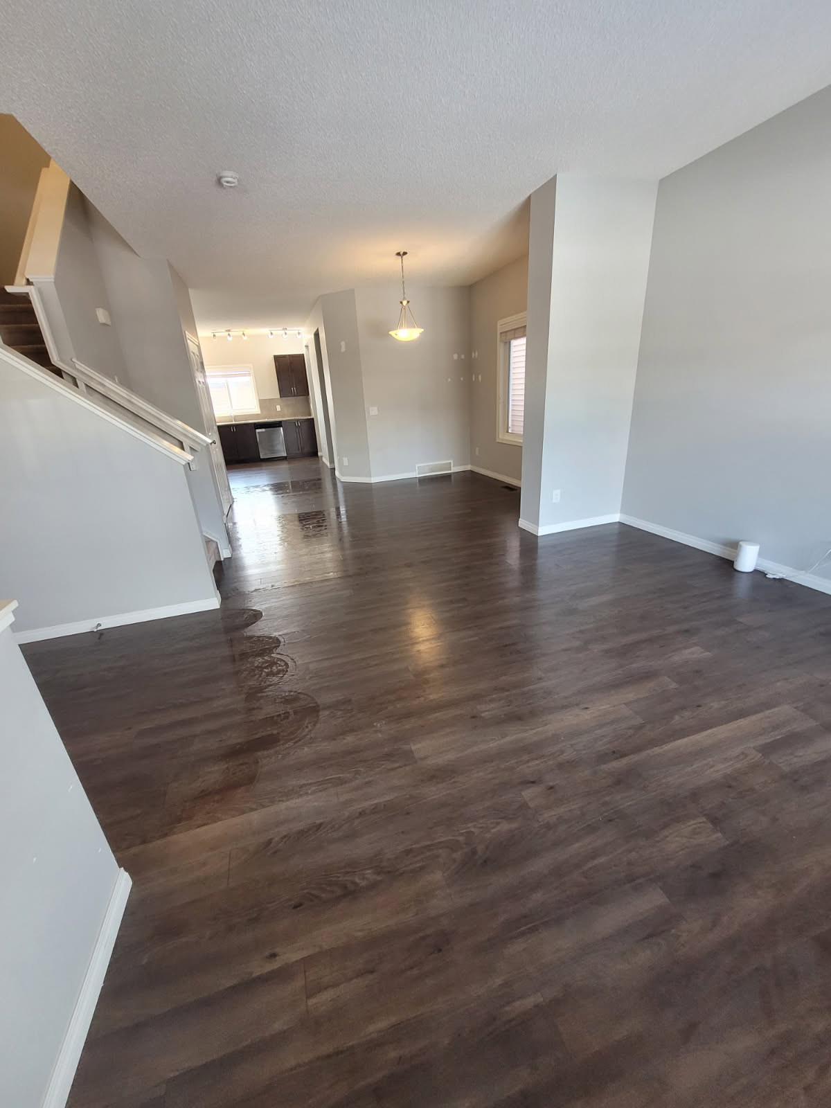 Spotless hardwood floors and kitchen in a cleaned Calgary home