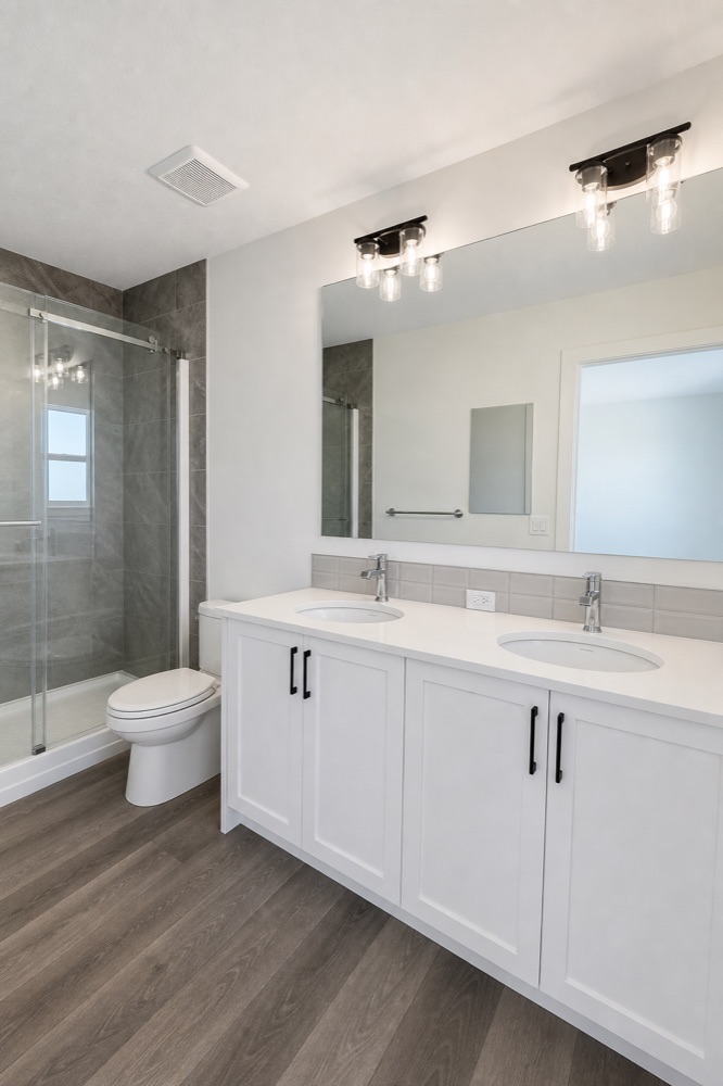 Finished double-vanity bathroom after a NeatNow clean in Calgary