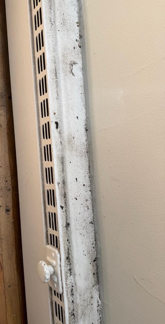 Before photo of a heating vent caked with grime and dust, before a NeatNow clean in Calgary